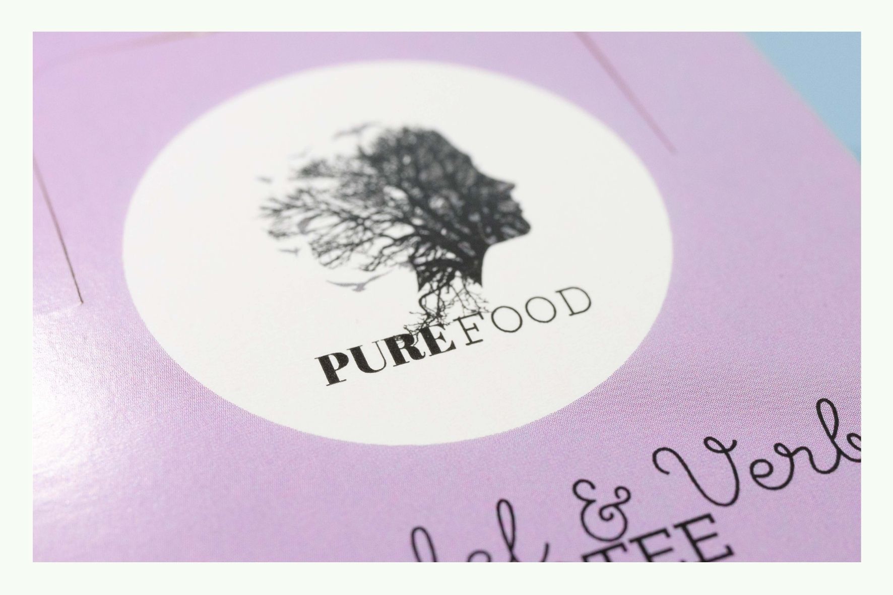 Close-up of a logo on pink cardboard packaging Close-up of a logo on pink cardboard packaging