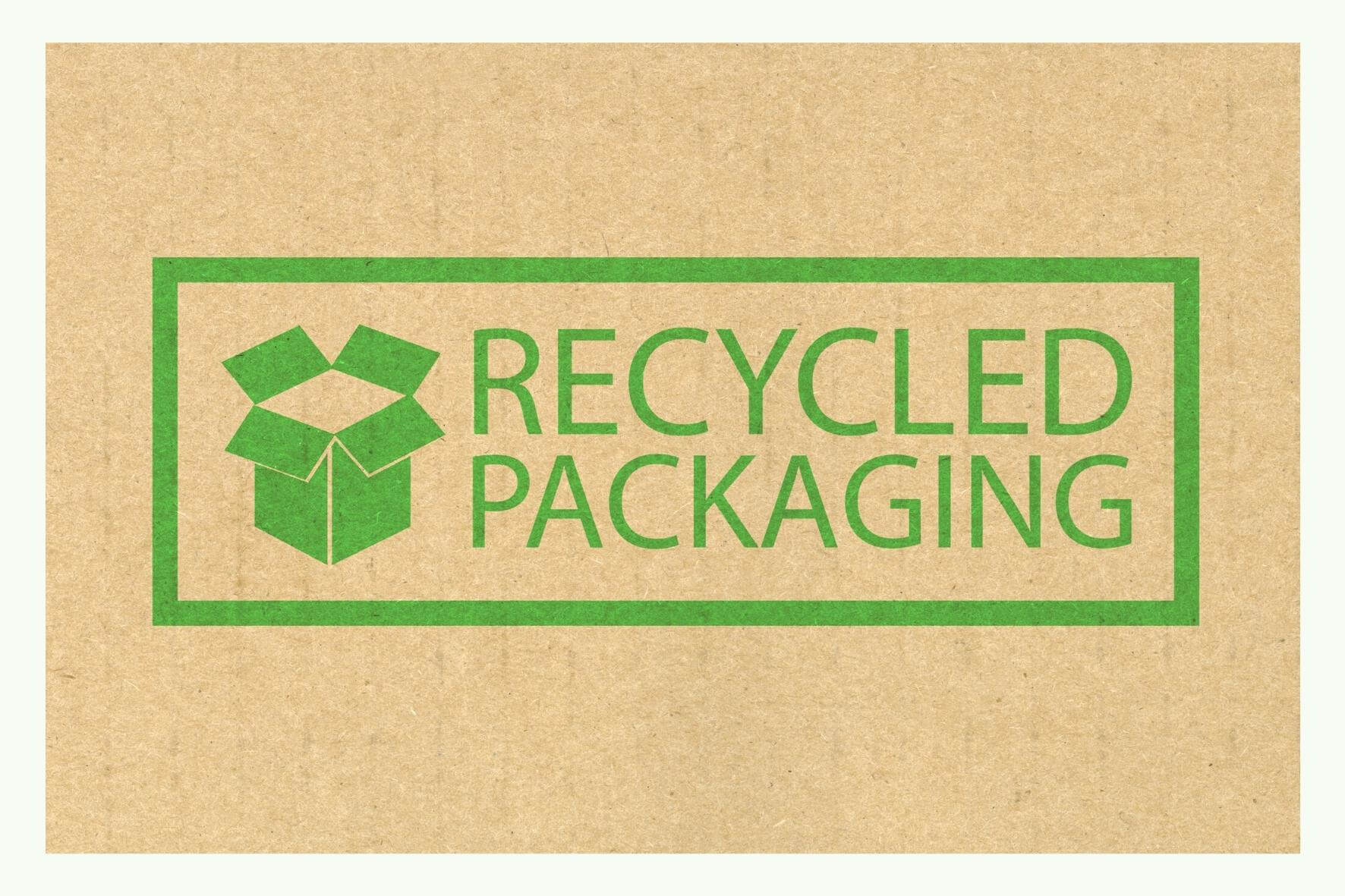 Green logo with the text Recycled Packaging on brown cardboard